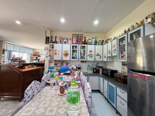 Cozy kitchen with dining table and cabinets