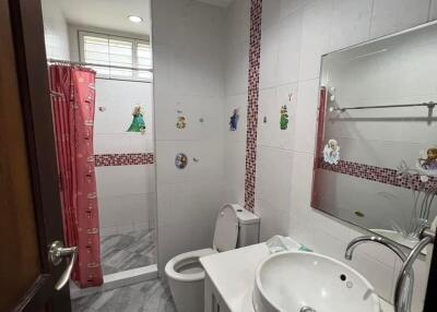 Bathroom with a sink, toilet, and shower