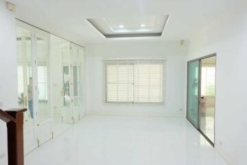 Bright and spacious main living area with modern lighting and large window