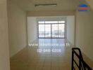 Bright living room with large windows and balcony access