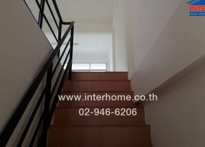 Interior staircase with black railings