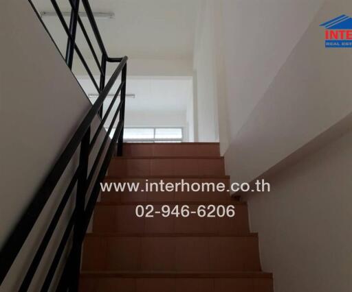 Interior staircase with black railings