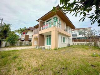 Exterior view of a modern two-story house with lawn