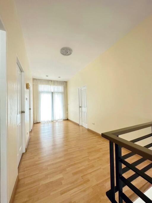 Bright hallway with wooden flooring