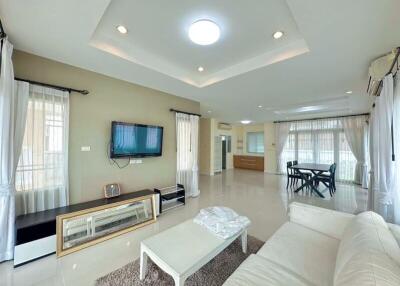 Spacious and bright main living space with modern furnishings and ample lighting