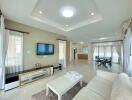 Spacious and bright main living space with modern furnishings and ample lighting