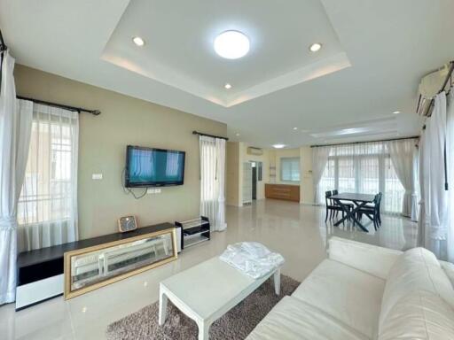 Spacious and bright main living space with modern furnishings and ample lighting