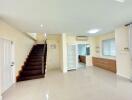 Spacious living area with stairway