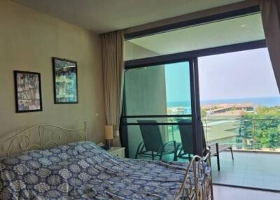 Bedroom with balcony and ocean view