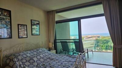 Bedroom with balcony and ocean view