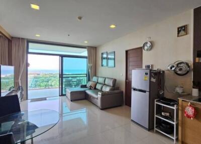 Modern living room with large windows and sea view