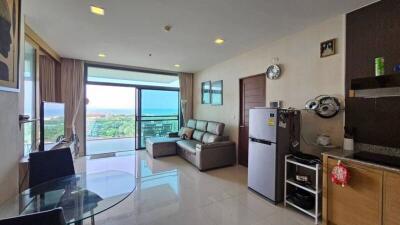 Modern living room with large windows and sea view