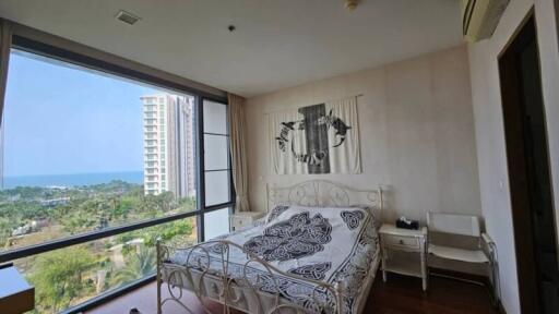 Bright bedroom with large windows and a view