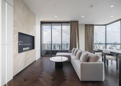 Modern living room with floor-to-ceiling windows and city view