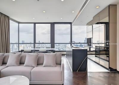 Modern living room with city view and adjacent kitchen