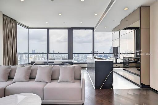 Modern living room with city view and adjacent kitchen