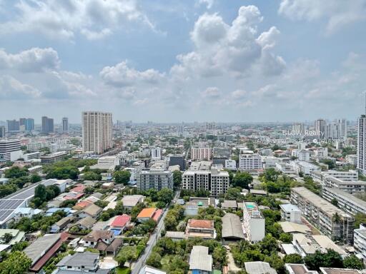 City skyline view with buildings and cloudy sky