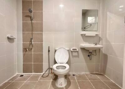 Spacious bathroom with shower and toilet