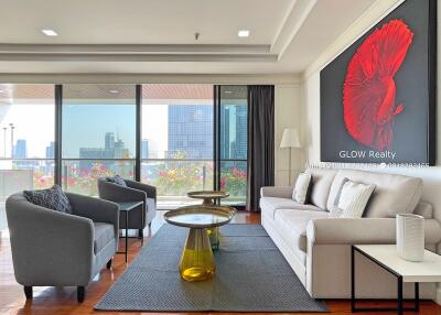 Modernly furnished living room with city view