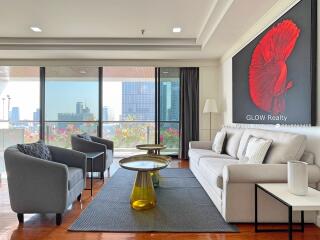 Modernly furnished living room with city view