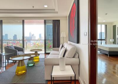 Modern living room with large windows and city view