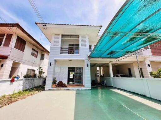 Two-story house with a carport