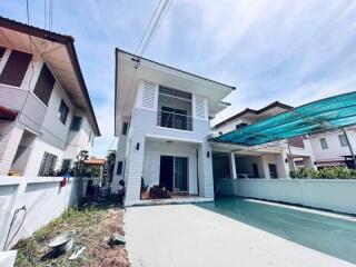 Front view of a modern two-story house with driveway