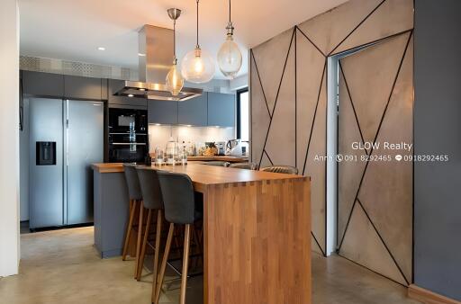 Modern kitchen with island and hanging lights