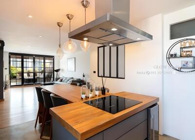 Modern kitchen with island and open living area