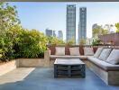 Modern city balcony with seating area and city view