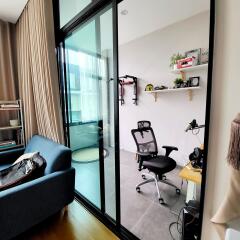 Modern home office with glass sliding doors