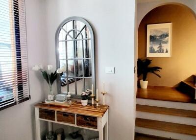 Bright living area with decorative console table and mirror