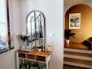 Bright living area with decorative console table and mirror