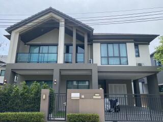 Front view of a modern two-story house with a garage