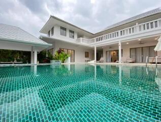 Outdoor view of the pool area with building in the background