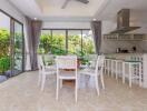 Modern open kitchen with dining area and large windows