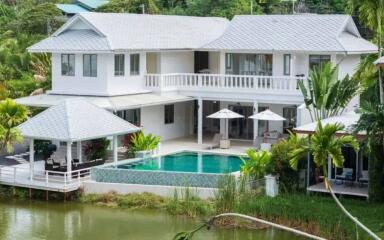 Spacious two-story house with swimming pool and outdoor seating area