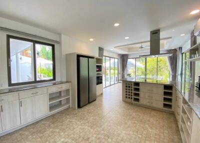 Spacious modern kitchen with ample natural light and large windows
