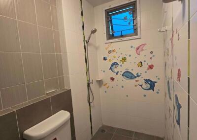 Bathroom with marine-themed decor and wall stickers