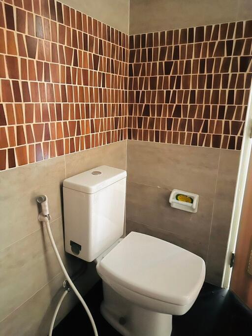 Modern bathroom with tiled walls