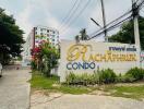 Condo building entrance with signboard