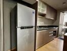 Modern kitchen with stainless steel appliances and wooden cabinetry