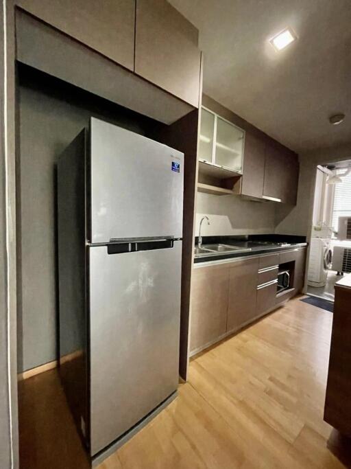 Modern kitchen with stainless steel appliances and wooden cabinetry