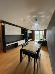 Modern living room with dining area and large window