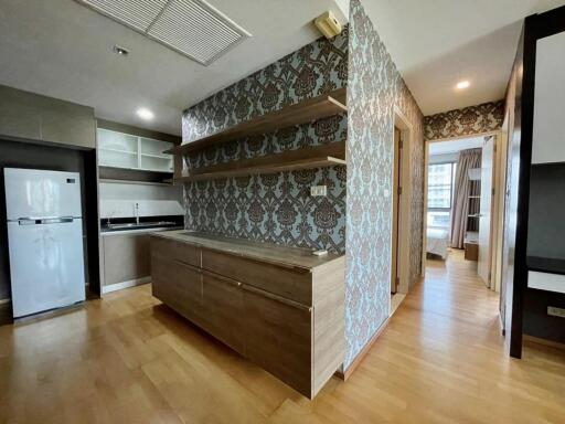 Modern kitchen with wooden cabinets and open shelving