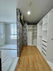 Spacious bedroom with built-in closets and a view into the bathroom