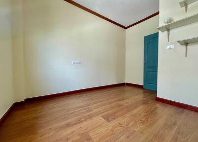 Empty bedroom with wooden floor