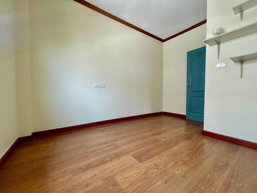 Empty bedroom with wooden floor