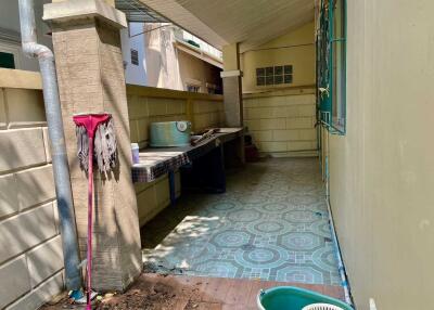 Covered outdoor area with tiled flooring