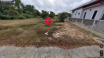 Vacant land beside a building